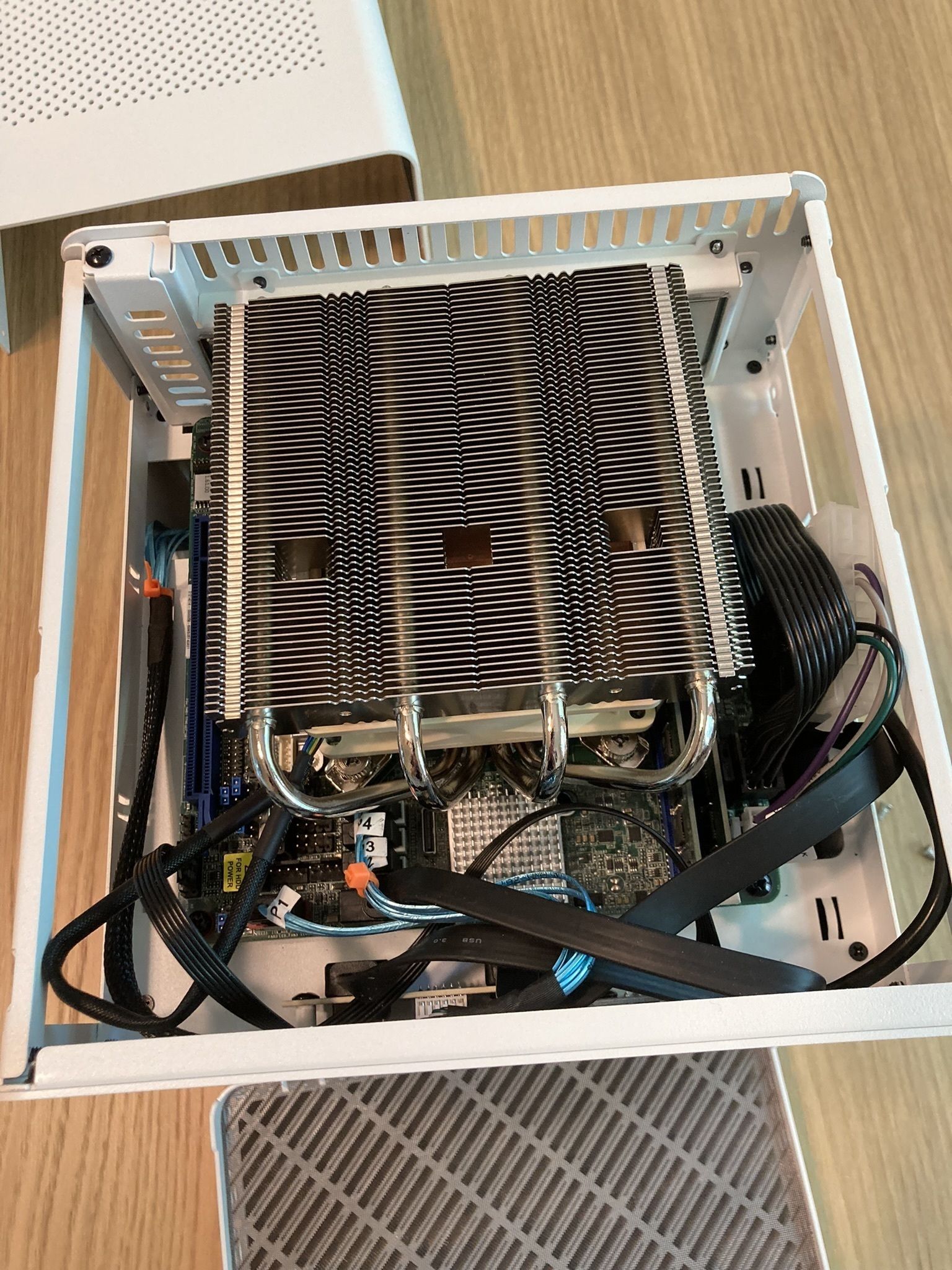 After installing the motherboard. The length of the front panel and PSU cables makes cable management a bit annoying. The USB header is about an inch away from the front panel but the cable is almost 10 times that.